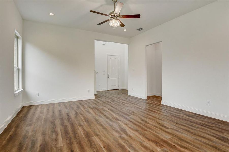 Unfurnished dining area featuring plenty of natural light, a chandelier, and dark hardwood / wood-style floors