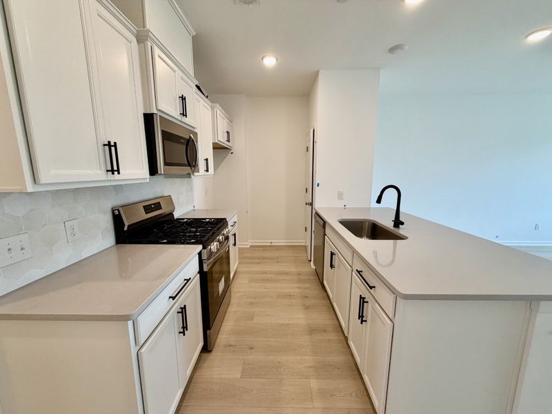 Furnished interior view inside a new home in Nexus Townhomes, Gallatin (Image 8).