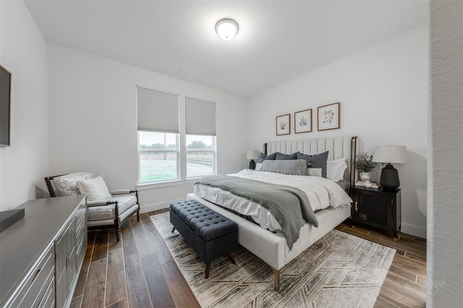 Guest room located on first floor.  This serene space tucked away at the back of the home, offers a serene, quiet space to the guest.  The windows overlook the pasture-like property.