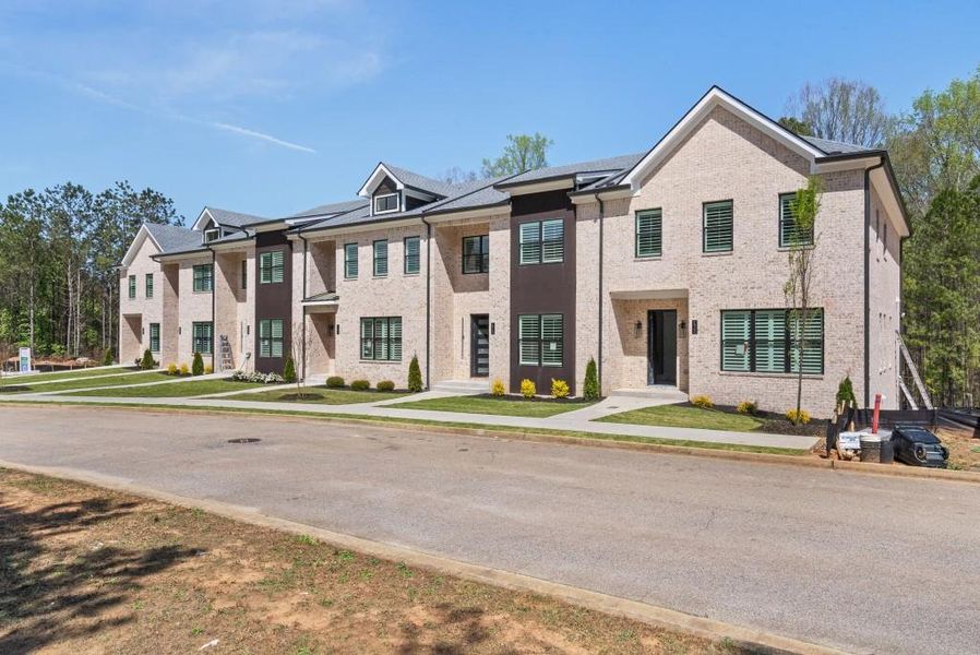 Front exterior of a new home in , Stockbridge, GA, highlighting curb appeal (Image 26).