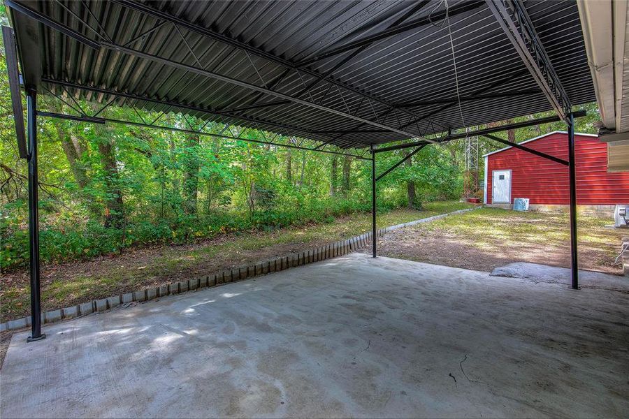 View of patio with an outdoor structure