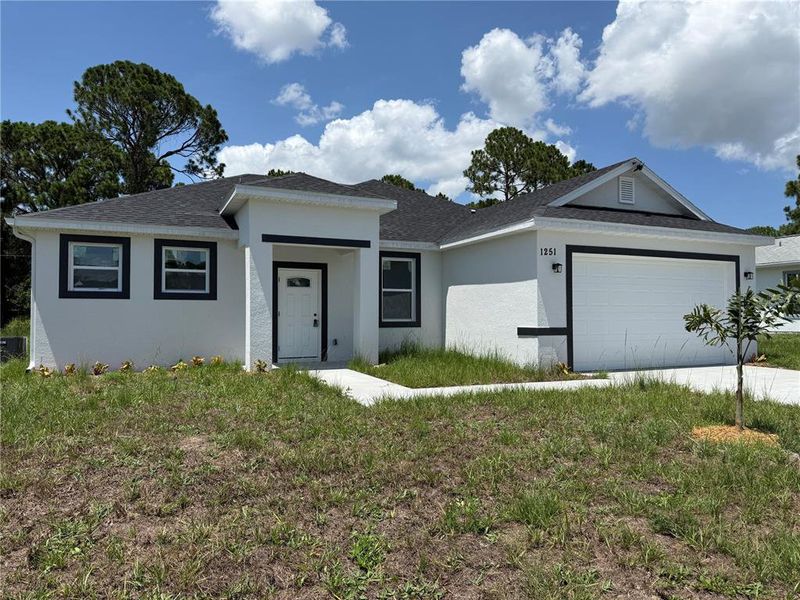 Front exterior of a new home in , Palm Bay, FL, highlighting curb appeal (Image 1). Front exterior of a new home in , Palm Bay, FL, highlighting curb appeal (Image 1).