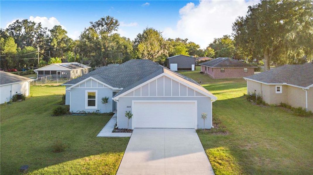 Front exterior of a new home in , Fort Meade, FL, highlighting curb appeal (Image 21). Front exterior of a new home in , Fort Meade, FL, highlighting curb appeal (Image 21).