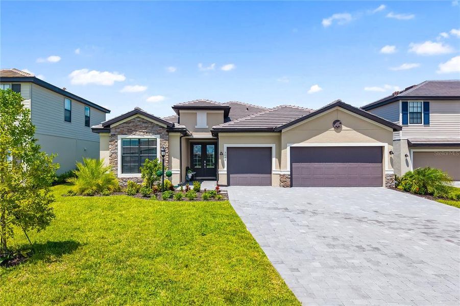 Front exterior of a new home in , Bradenton, FL, highlighting curb appeal (Image 22).