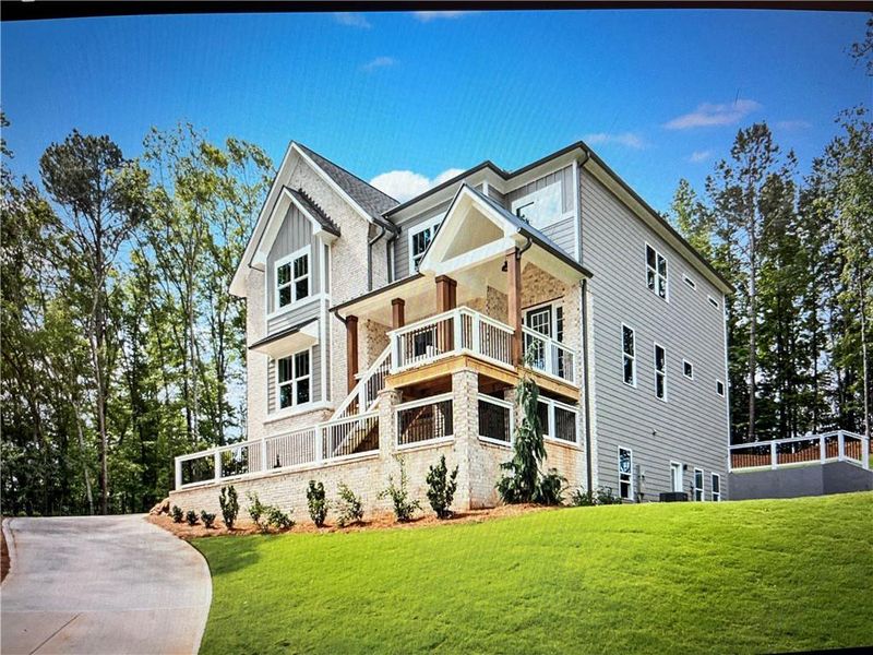 Front exterior of a new home in Liberty Springs, Woodstock, GA, highlighting curb appeal (Image 28). Front exterior of a new home in Liberty Springs, Woodstock, GA, highlighting curb appeal (Image 28).
