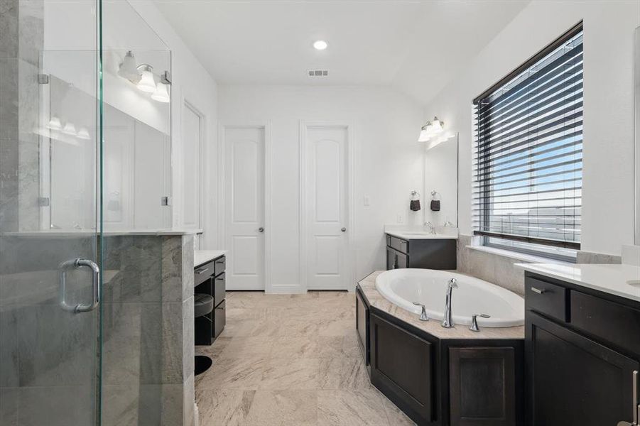 The exceptional Primary Bath has 2 separate vanity areas.