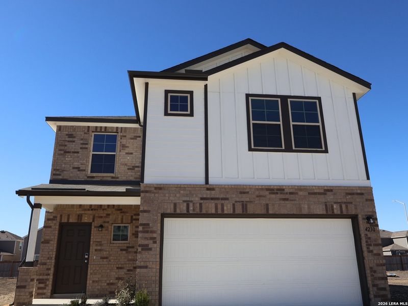 Front exterior of a new home in Park Place, New Braunfels, TX, highlighting curb appeal (Image 12). Front exterior of a new home in Park Place, New Braunfels, TX, highlighting curb appeal (Image 12).