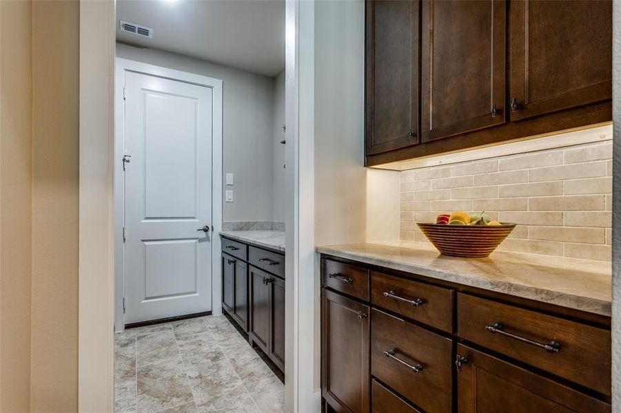 Butler’s pantry adds extra storage and prep space