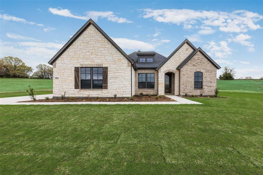 Front exterior of a new home in King Crossing Estates, Van Alstyne, TX, highlighting curb appeal (Image 26). Front exterior of a new home in King Crossing Estates, Van Alstyne, TX, highlighting curb appeal (Image 26).