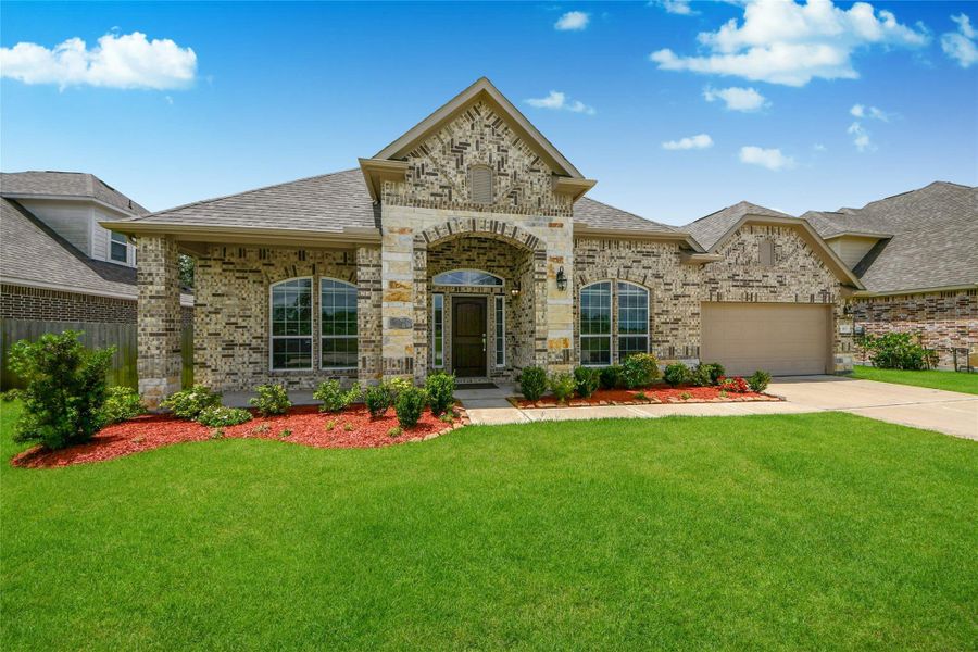 Front exterior of a new home in Elm Estates, Angleton, TX, highlighting curb appeal (Image 25).