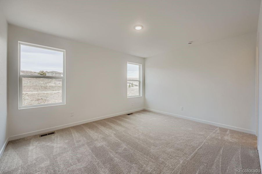 Spacious, unfurnished interior of a new home in Preserve at Mesa Creek: The Celestial Collection, Colorado Springs (Image 8).