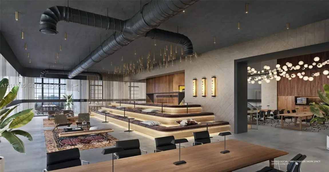 Industrial-style space featuring exposed ductwork, tiered wood-finish seating with integrated lighting, concrete flooring, decorative globe light fixtures, and paneled wall accents