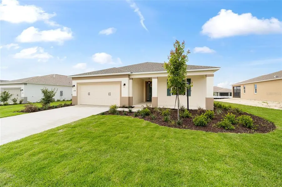 Front exterior of a new home in , Ocala, FL, highlighting curb appeal (Image 21). Front exterior of a new home in , Ocala, FL, highlighting curb appeal (Image 21).