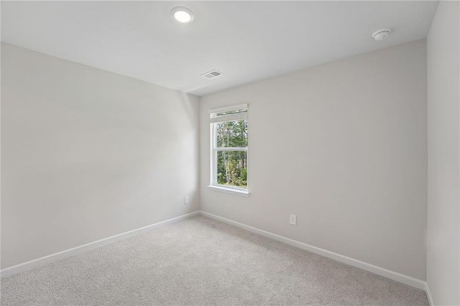 Spacious, unfurnished interior of a new home in Northwoods at Mirror Lake, Villa Rica (Image 49).