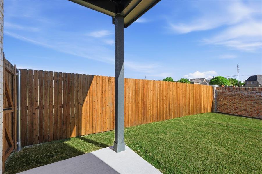 Fenced backyard featuring a patio Fenced backyard featuring a patio