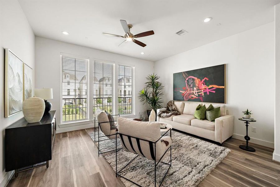 Bright light fills this home! The three huge living room windows look out onto our Beautiful fountain area.