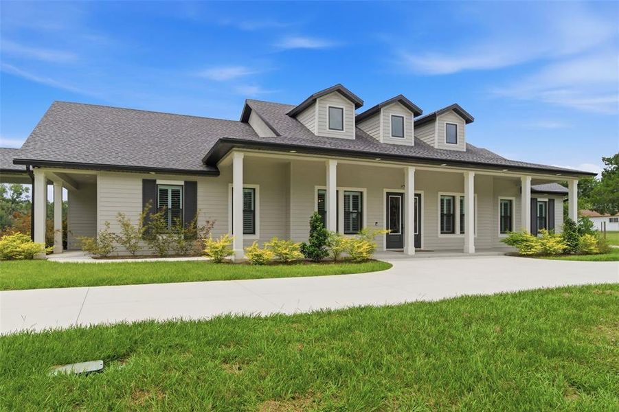 Front exterior of a new home in , Dade City, FL, highlighting curb appeal (Image 28). Front exterior of a new home in , Dade City, FL, highlighting curb appeal (Image 28).