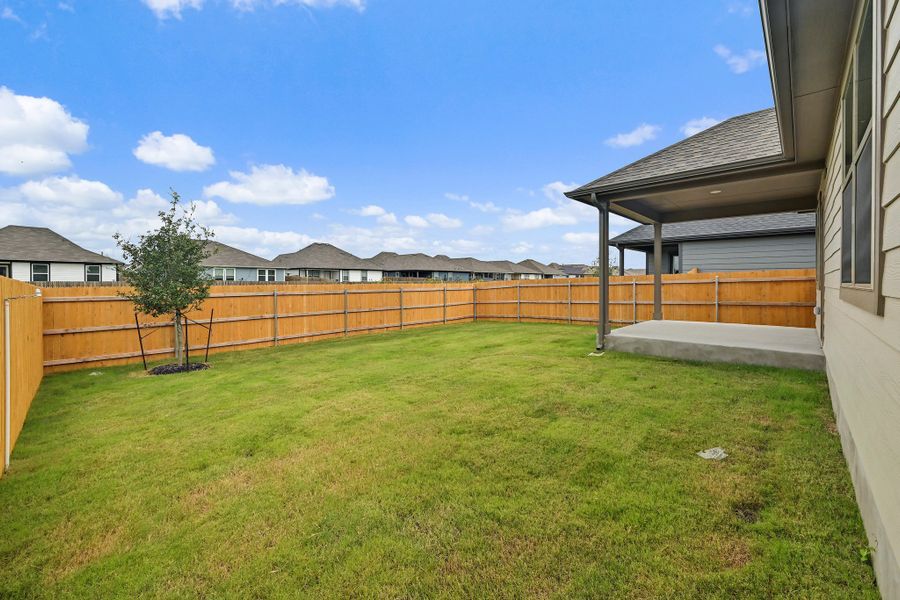 Exterior details and patio area of a home in Prairie Winds, Hutto (Image 23).