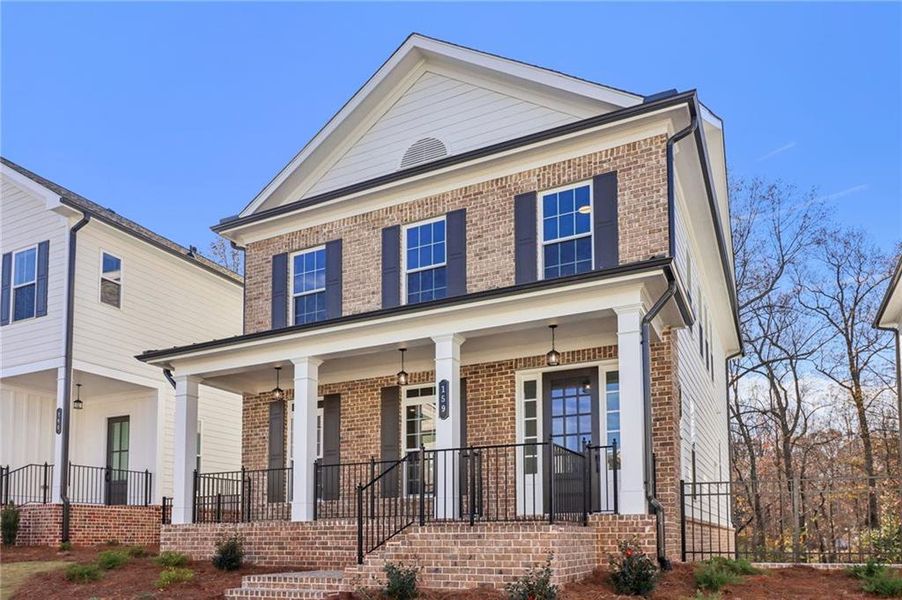 Front exterior of a new home in Brackley Single Family, Cumming, GA, highlighting curb appeal (Image 29). Front exterior of a new home in Brackley Single Family, Cumming, GA, highlighting curb appeal (Image 29).