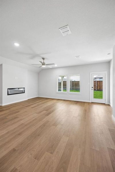 Living Room in the Oscar home plan by Trophy Signature Homes - REPRESENTATIVE PH (2)