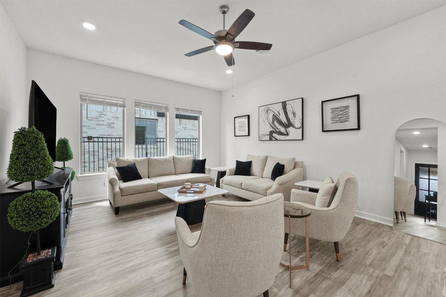 Spacious living room with soaring 12-foot ceilings and natural light. Spacious living room with soaring 12-foot ceilings and natural light.