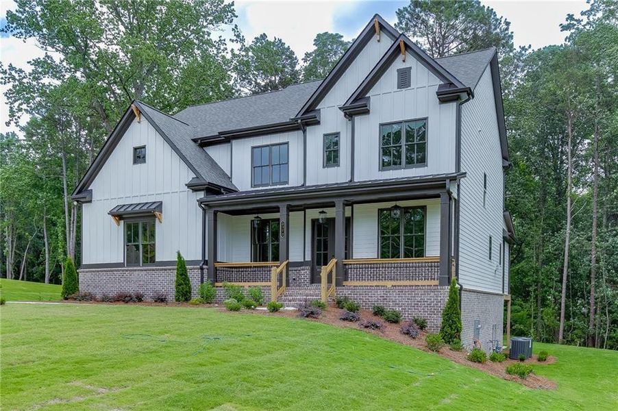 Front exterior of a new home in , Cumming, GA, highlighting curb appeal (Image 1). Front exterior of a new home in , Cumming, GA, highlighting curb appeal (Image 1).