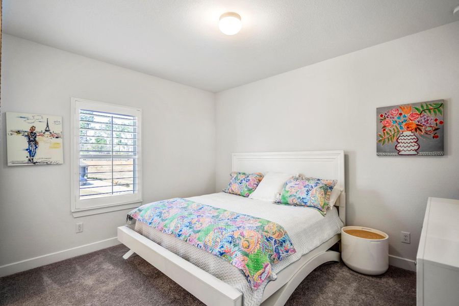One of two secondary bedrooms on the 2nd level. This one includes an en-suite bathroom.