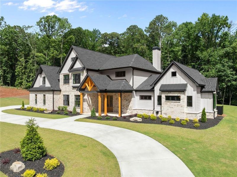 Front exterior of a new home in , Hoschton, GA, highlighting curb appeal (Image 27).