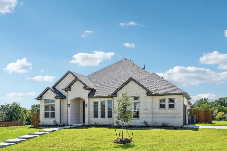 Front exterior of a new home in Sheppard's Place, Waxahachie, TX, highlighting curb appeal (Image 20).