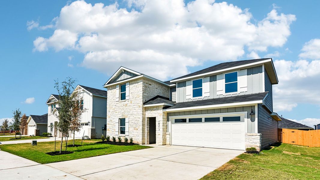 Front exterior of a new home in Monarch Ranch, Manor, TX, highlighting curb appeal (Image 23).