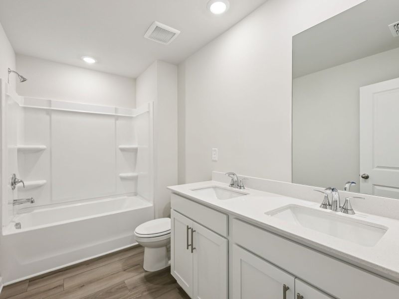 Furnished interior view inside a new home in Northwoods at Mirror Lake, Villa Rica (Image 9).