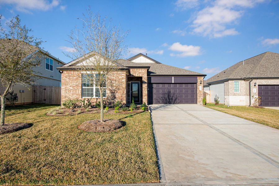 Front exterior of a new home in Bluestem, Brookshire, TX, highlighting curb appeal (Image 1). Front exterior of a new home in Bluestem, Brookshire, TX, highlighting curb appeal (Image 1).