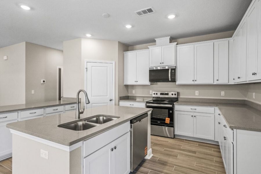 Furnished interior view inside a new home in Natureview, Freeport (Image 6).