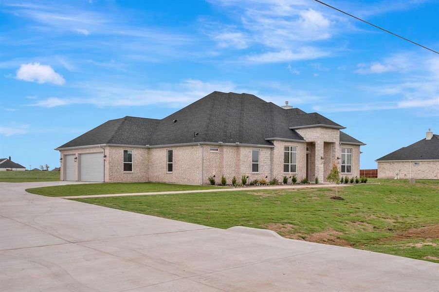 Front exterior of a new home in , Venus, TX, highlighting curb appeal (Image 1). Front exterior of a new home in , Venus, TX, highlighting curb appeal (Image 1).