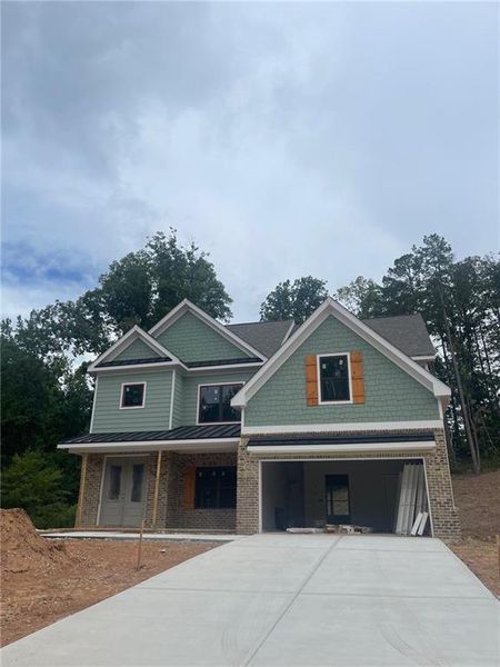 Front exterior of a new home in , Cumming, GA, highlighting curb appeal (Image 1). Front exterior of a new home in , Cumming, GA, highlighting curb appeal (Image 1).