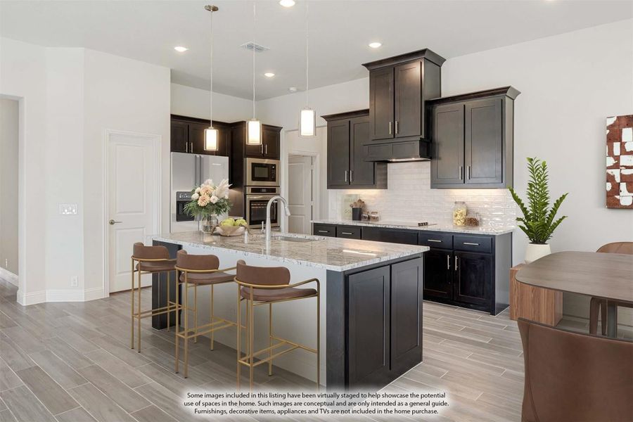Kitchen with dark cabinets, granite island with seating, white subway tile backsplash, and stainless steel appliances Kitchen with dark cabinets, granite island with seating, white subway tile backsplash, and stainless steel appliances