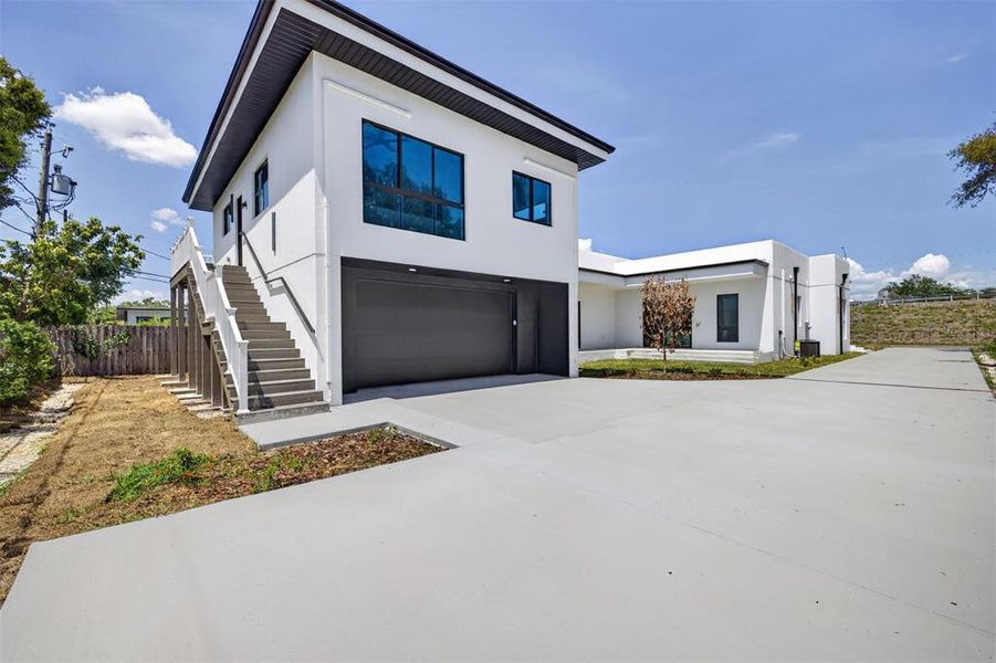 Front exterior of a new home in , St. Petersburg, FL, highlighting curb appeal (Image 24). Front exterior of a new home in , St. Petersburg, FL, highlighting curb appeal (Image 24).