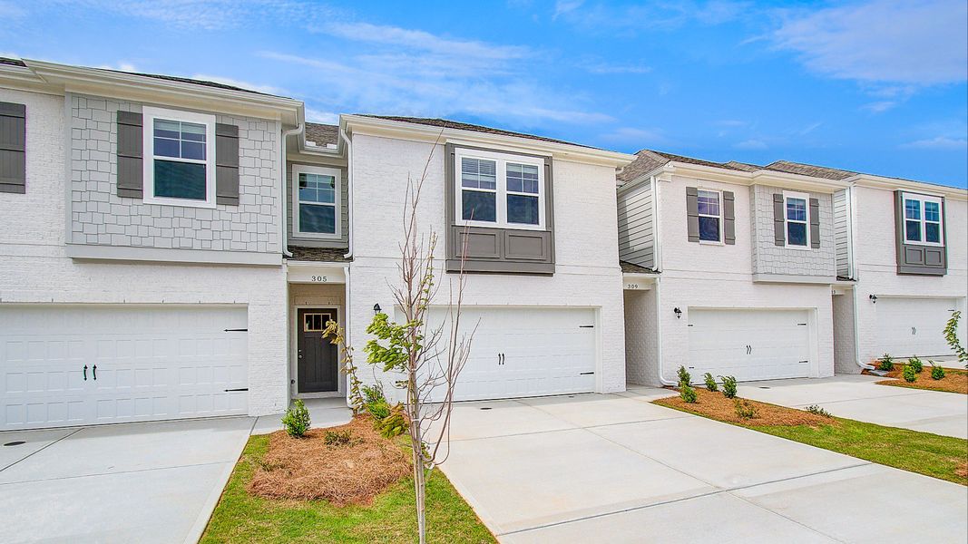 Front exterior of a new home in Bowers Farm Townhomes, McDonough, GA, highlighting curb appeal (Image 23). Front exterior of a new home in Bowers Farm Townhomes, McDonough, GA, highlighting curb appeal (Image 23).