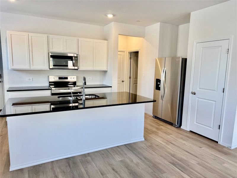 Furnished interior view inside a new home in Turner's Village, Buda (Image 4).