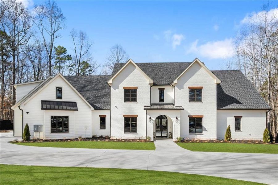 Front exterior of a new home in , Alpharetta, GA, highlighting curb appeal (Image 25). Front exterior of a new home in , Alpharetta, GA, highlighting curb appeal (Image 25).