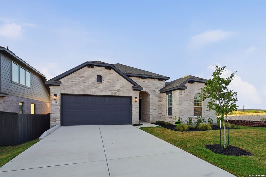 Front exterior of a new home in The Woodlands at Medina Hills, Mico, TX, highlighting curb appeal (Image 20).