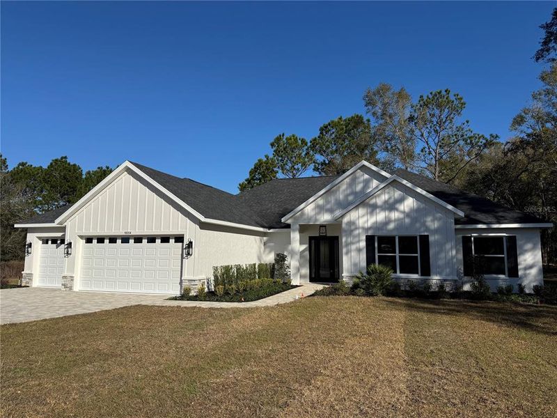 Front exterior of a new home in , Dunnellon, FL, highlighting curb appeal (Image 22). Front exterior of a new home in , Dunnellon, FL, highlighting curb appeal (Image 22).