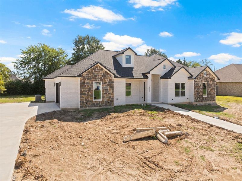 Front exterior of a new home in , Mount Pleasant, TX, highlighting curb appeal (Image 1). Front exterior of a new home in , Mount Pleasant, TX, highlighting curb appeal (Image 1).