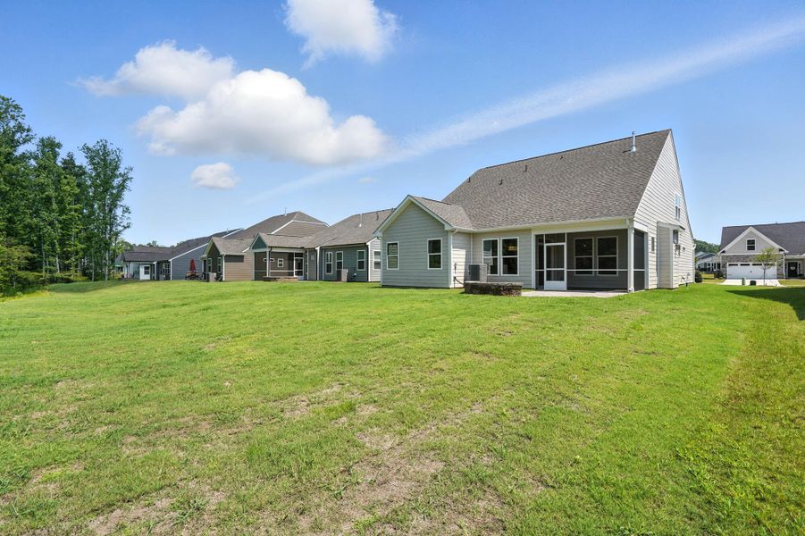 Front exterior of a new home in Heritage - 55+ Community, Wesley Chapel, NC, highlighting curb appeal (Image 21).