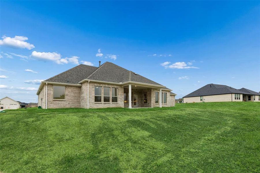 Exterior details and patio area of a home in Ellis Ranch Estates, Waxahachie (Image 4).