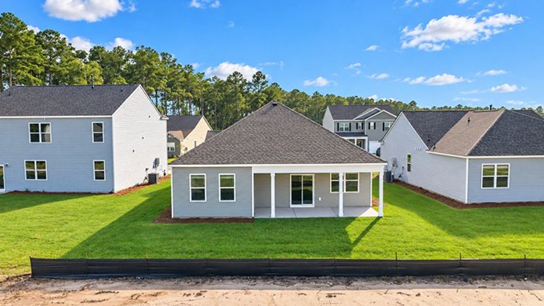 Exterior details and patio area of a home in Pine Hills at Cane Bay, Summerville (Image 3).