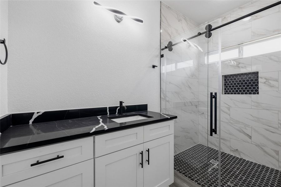 Bedroom 2 full walk-in bath.