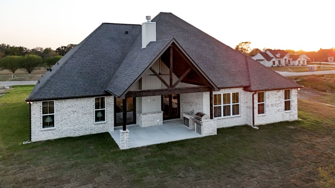 Exterior details and patio area of a home in Windmill Hill, Bryan (Image 34).