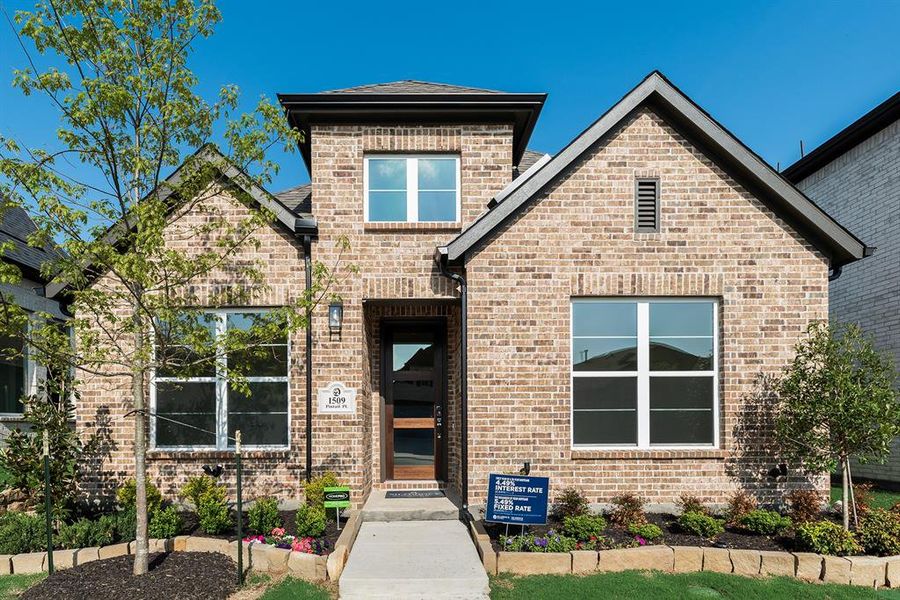 Front exterior of a new home in Cottages of Celina, Celina, TX, highlighting curb appeal (Image 22).