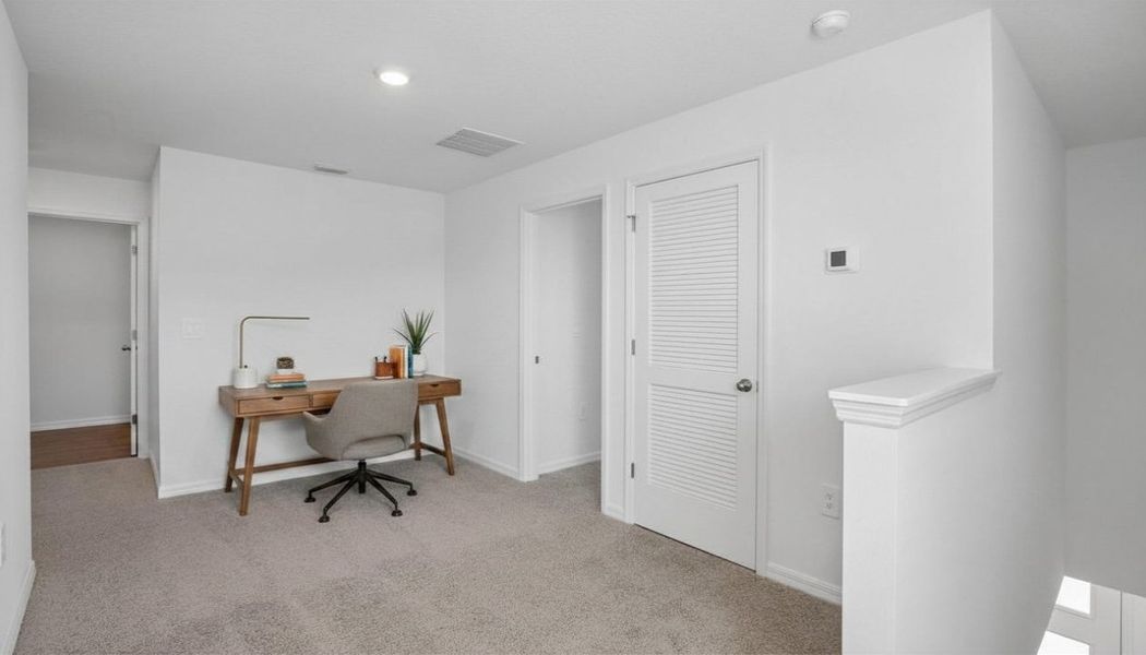 Representative furnished interior of a home built from the Robie Modern by D.R. Horton in Berry Bay, Wimauma (Image 6).